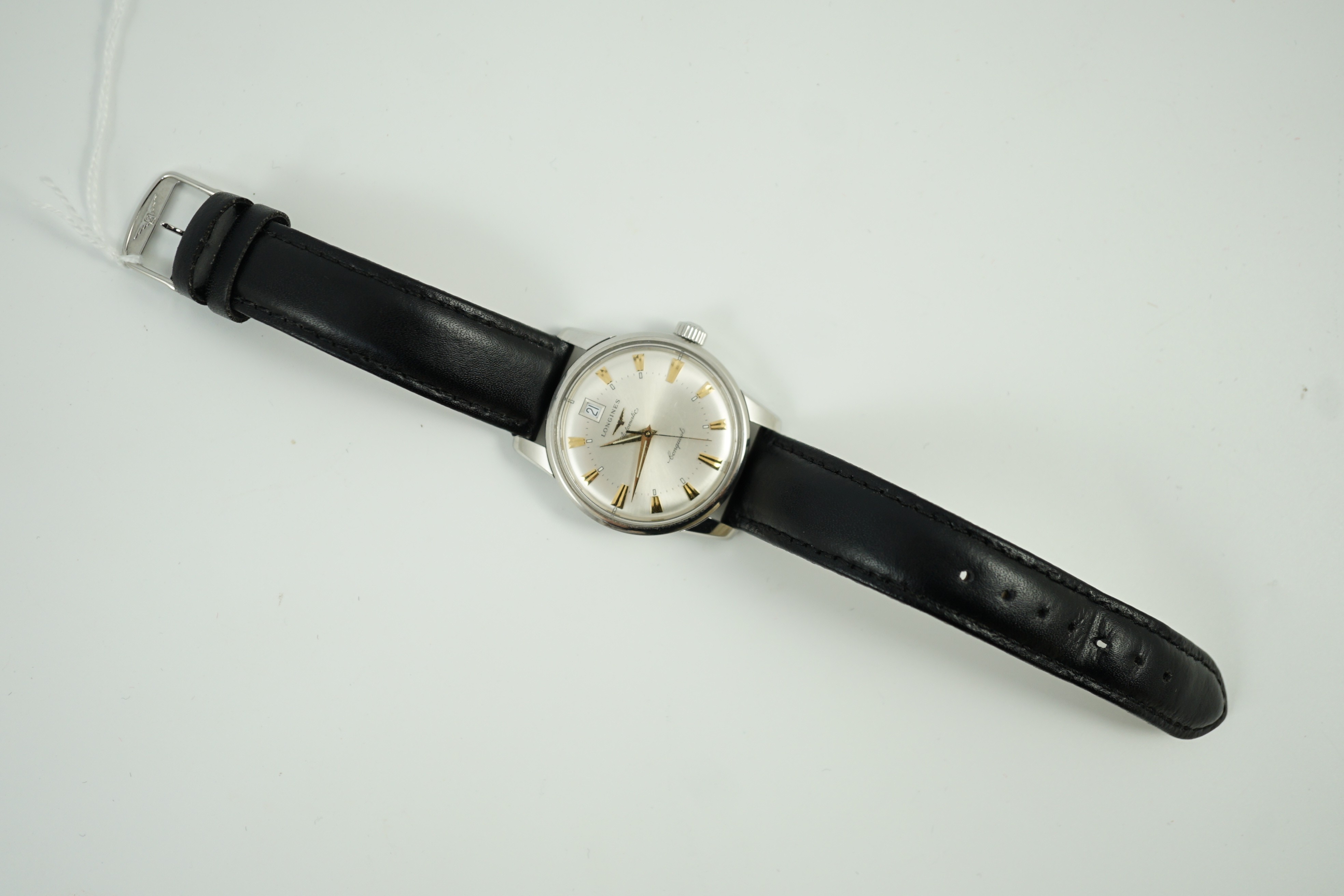 A gentleman's steel and enamel Longines Conquest Automatic wrist watch, with date aperture, case diameter 36mm, on a later associated leather strap.